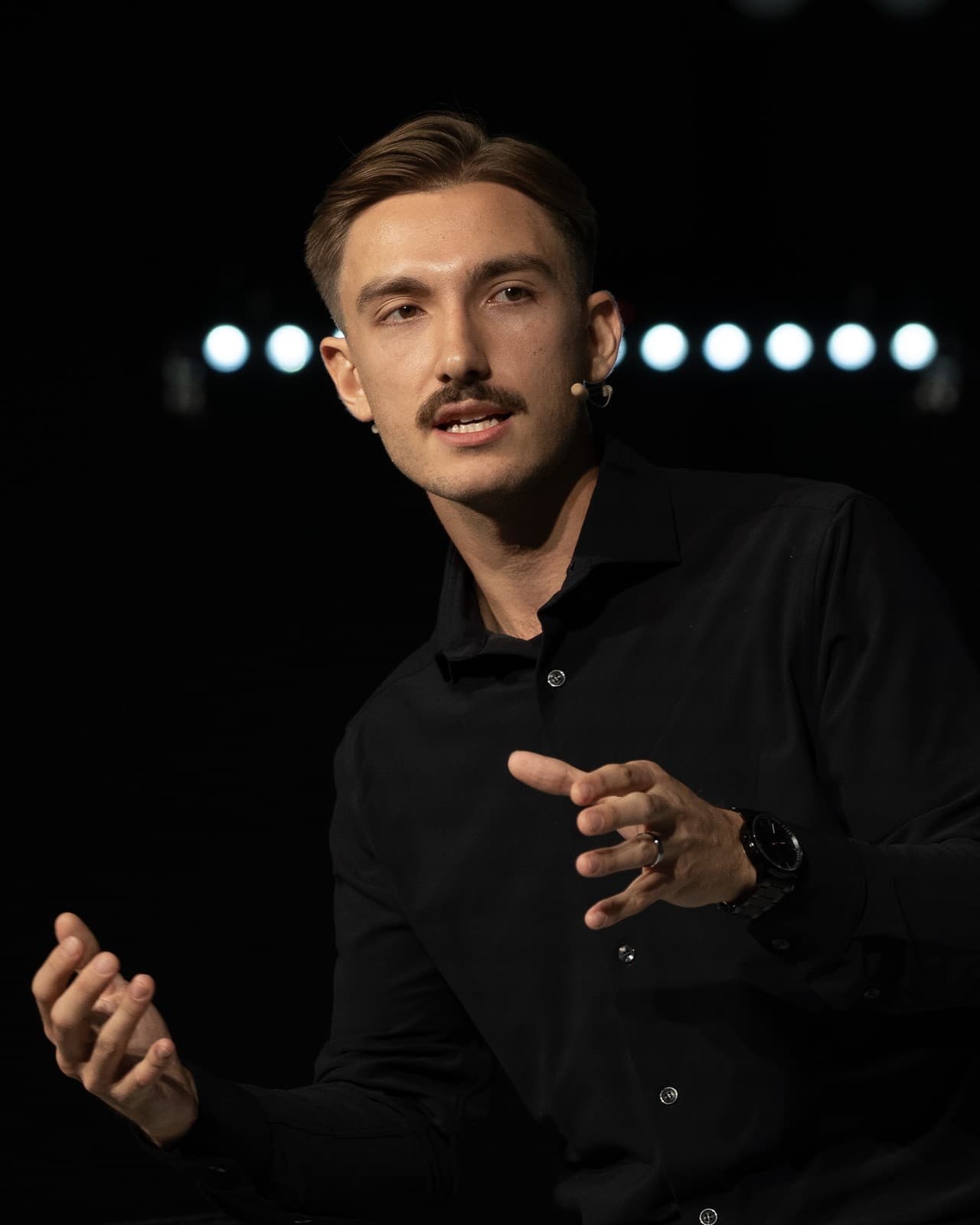 Ryan Whitton, Founder & CEO of Whitton Recruiting, speaking on stage